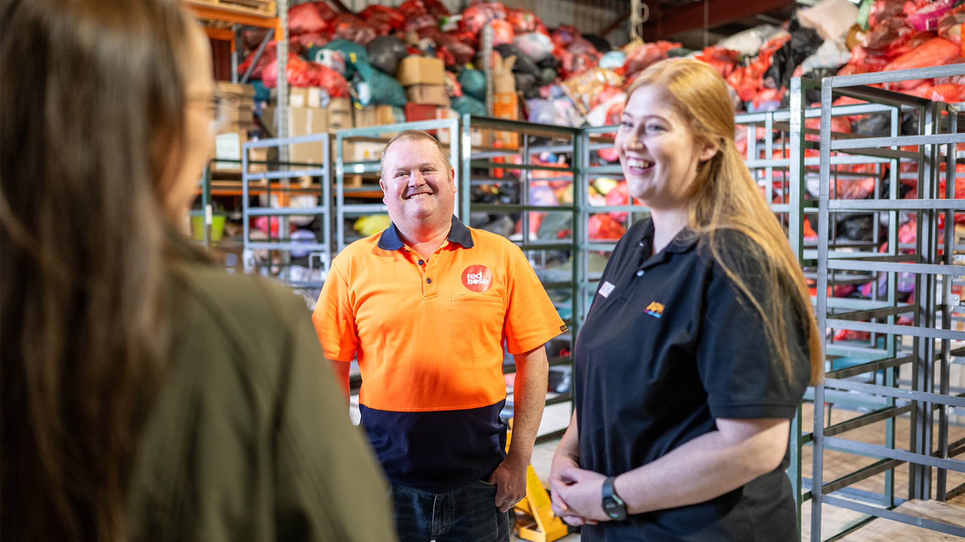 Employee with disability shows his work to an APM consultant